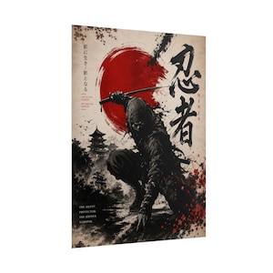 May include: A rectangular wall art print featuring a crouching ninja holding a sword against a large red sun. The design includes black ink-style illustrations of a pagoda, cherry blossoms, and Japanese kanji characters alongside the English text.