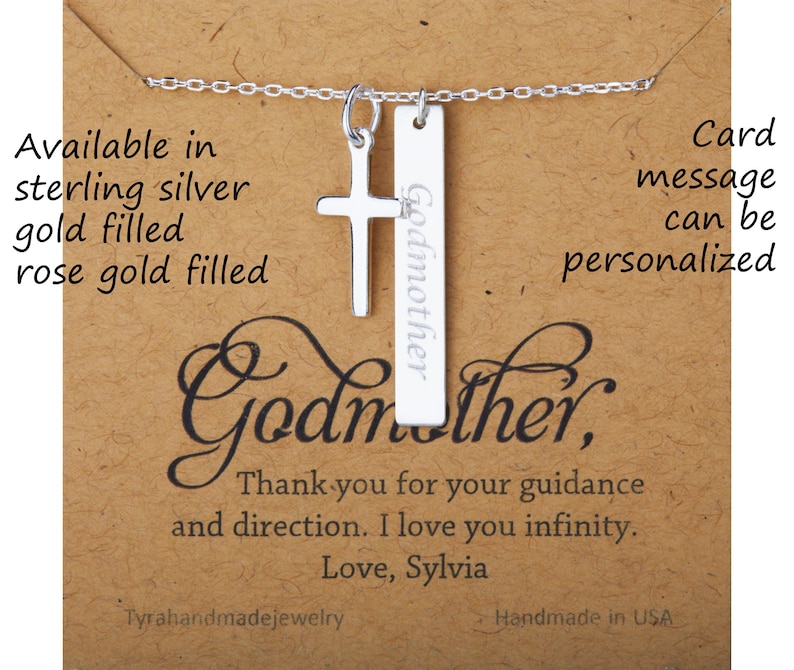 May include: Silver necklace with a cross charm and a pendant that says "Godmother". The card says "Card message can be personalized".