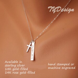 May include: Silver necklace with a cross charm and a rectangular pendant with the inscription "Psalm 34:4". The necklace is available in sterling silver, 14k gold-filled, and 14k rose gold-filled. The pendant can be hand-stamped or machine engraved.