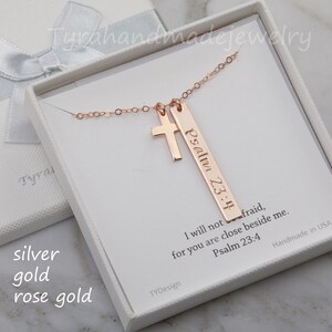 May include: Rose gold necklace with a cross charm and a bar pendant engraved with "Psalm 23:4" and the text "I will not be afraid, for you are close beside me. Psalm 23:4".