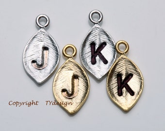 Add one gold or silver plated tiny leaf initial