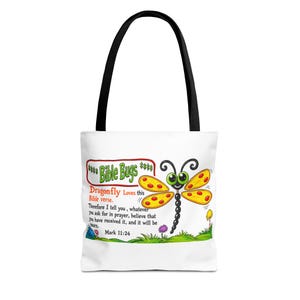 Bolso de mano con diseño de libélulas y motivos bíblicos, con versículo bíblico Marcos 11:24. Bolso infantil con temática de fe.