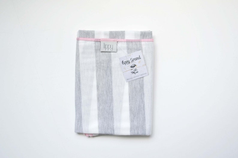 Gray, white, and pink girl blanket. Soft and stretchy knit fabric. Size medium / 31 by 40 inches. Handmade by Amy lippybrand. Baby accessory image 5