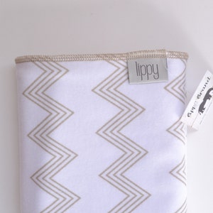 Baby blanket. Zig zag chevron print. Soft stretchy knit material. Size 31 by 40 inches. Colors beige and white. Unisex baby blanket. image 4