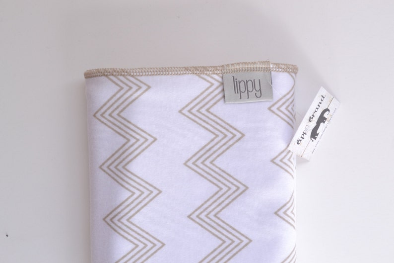 Baby blanket. Zig zag chevron print. Soft stretchy knit material. Size 31 by 40 inches. Colors beige and white. Unisex baby blanket. image 4