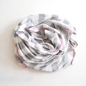 Gray, white, and pink girl blanket. Soft and stretchy knit fabric. Size medium / 31 by 40 inches. Handmade by Amy lippybrand. Baby accessory image 1