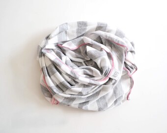 Gray, white, and pink girl blanket. Soft and stretchy knit fabric. Size medium / 31 by 40 inches. Handmade by Amy lippybrand. Baby accessory