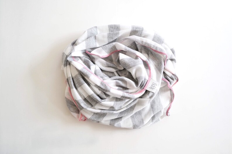 Gray, white, and pink girl blanket. Soft and stretchy knit fabric. Size medium / 31 by 40 inches. Handmade by Amy lippybrand. Baby accessory image 1