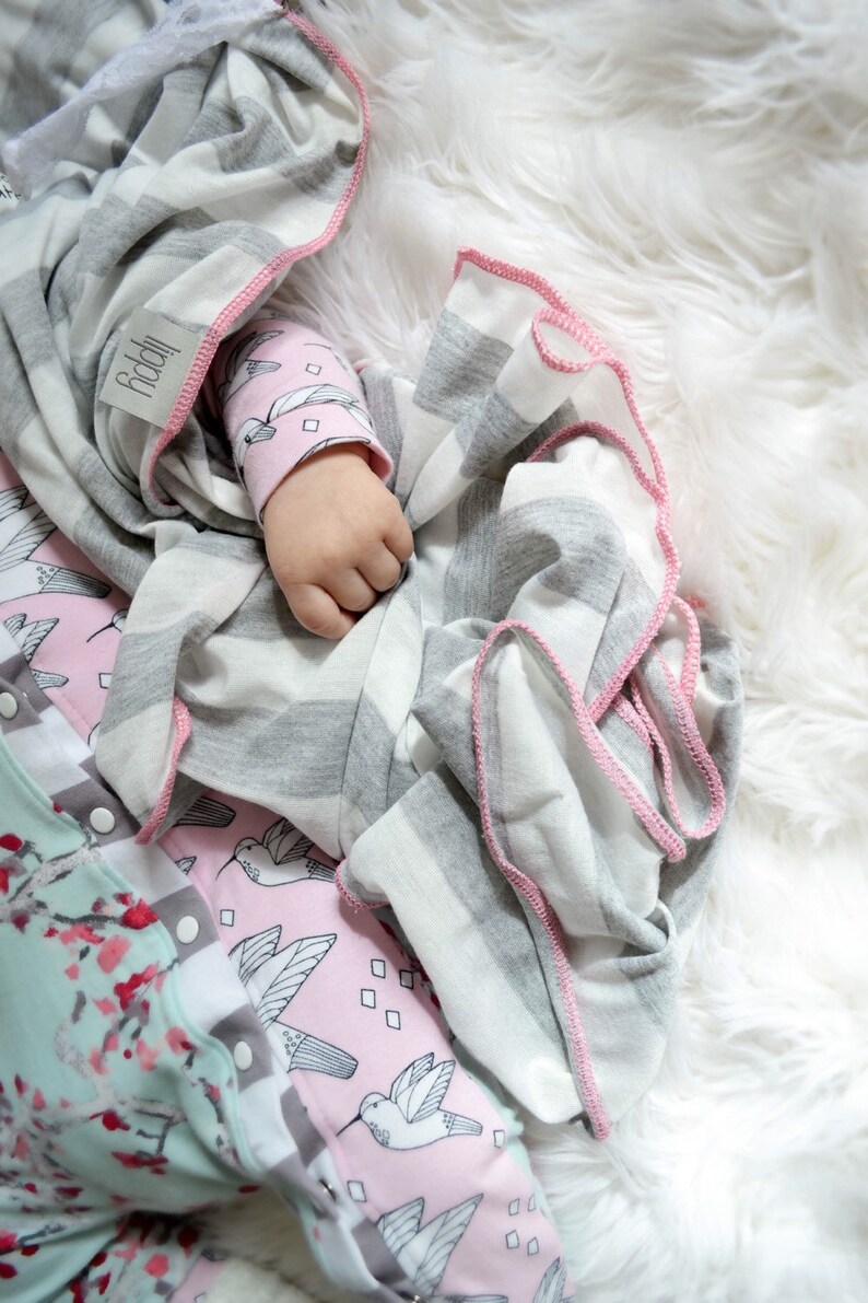 Gray, white, and pink girl blanket. Soft and stretchy knit fabric. Size medium / 31 by 40 inches. Handmade by Amy lippybrand. Baby accessory image 3