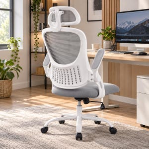 May include: A white ergonomic office chair with a gray mesh backrest, a gray padded seat, and an adjustable headrest. The chair features a white frame with a lumbar support section, flip-up armrests, and a five-point base with rolling casters.