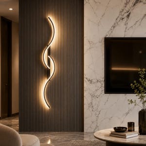 May include: A vertical wall-mounted light fitting featuring two interlocking, curved black metal arms that emit a warm, soft glow along their inner edges, creating a continuous S-shaped illumination pattern against a dark, ribbed wall panel.