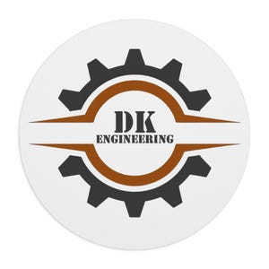 May include: A circular logo featuring a dark gray gear icon with a brown circular border. The text DK is centered in the middle, with the word ENGINEERING positioned directly below it. The design is set against a plain white background.