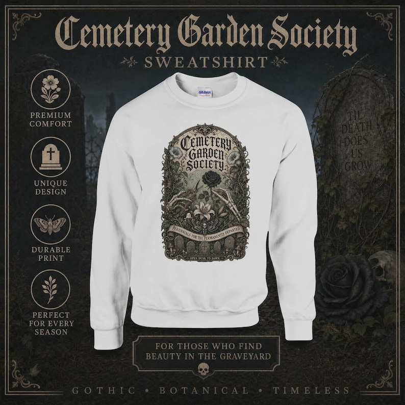 May include: A white crewneck sweatshirt featuring a central graphic with the text Cemetery Garden Society. The illustration depicts skeletal hands holding a black rose and a white lily, surrounded by ornate botanical details and tombstones.