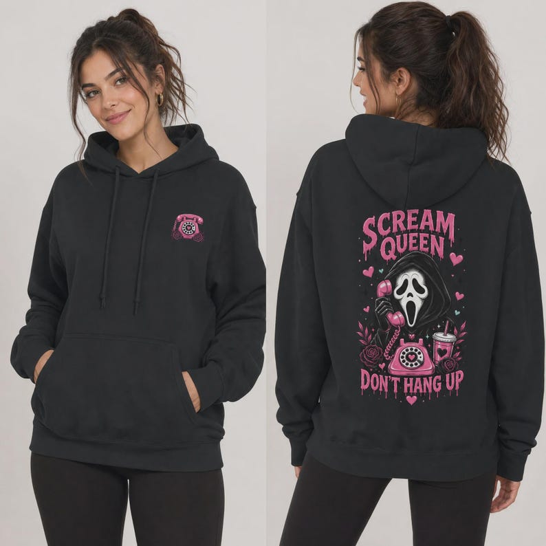 May include: A black hooded sweatshirt featuring a small pink rotary phone graphic on the front left chest. The back displays a large pink graphic of a masked figure holding a rotary phone with the text "SCREAM QUEEN DON'T HANG UP" and hearts.