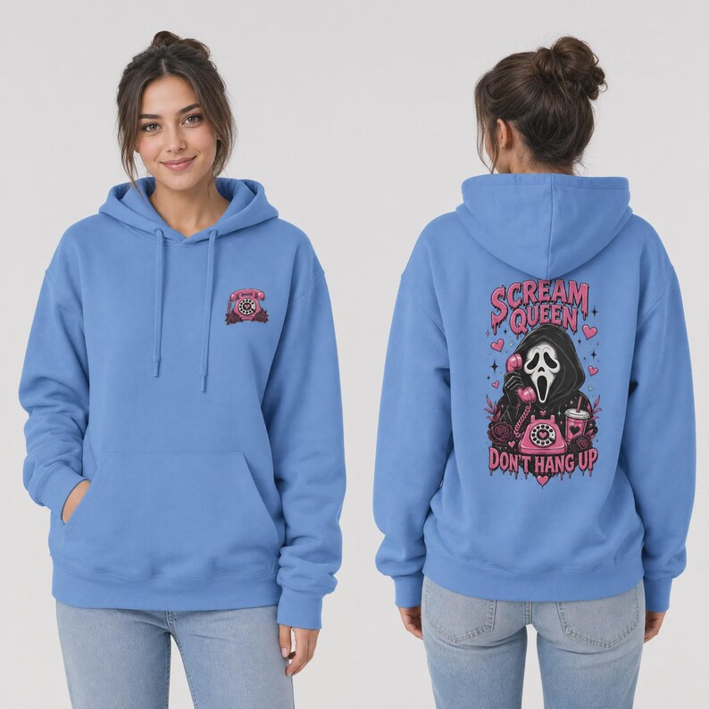 May include: A light blue hooded sweatshirt featuring a small pink rotary phone graphic on the front left chest. The back displays a large graphic of a masked figure holding a pink rotary phone with the text Scream Queen Don't Hang Up.