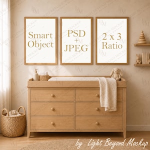 May include: A light wood dresser with six drawers, topped with a changing pad and a white blanket. Three framed posters hang above, featuring the text Smart Object, PSD JPEG, and 2 x 3 Ratio. A woven basket with a plush toy sits on the floor.