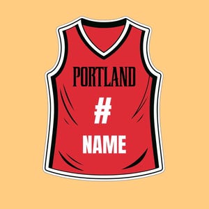 May include: A red sleeveless basketball jersey featuring black trim around the neckline and armholes. The word PORTLAND is printed in black, followed by a white hashtag symbol and the word NAME in white block letters on the front chest.