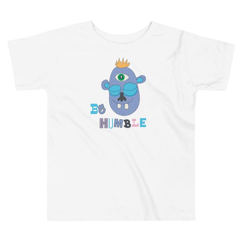 Kids Graphic Tee – BE HUMBLE Magu Shirt | Third-Eye Monster Character | Conscious Kids Clothing for the Whole Family | Toddler & Youth Gift