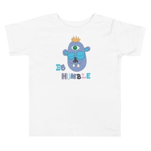 Kids Graphic Tee – BE HUMBLE Magu Shirt | Third-Eye Monster Character | Conscious Kids Clothing for the Whole Family | Toddler & Youth Gift