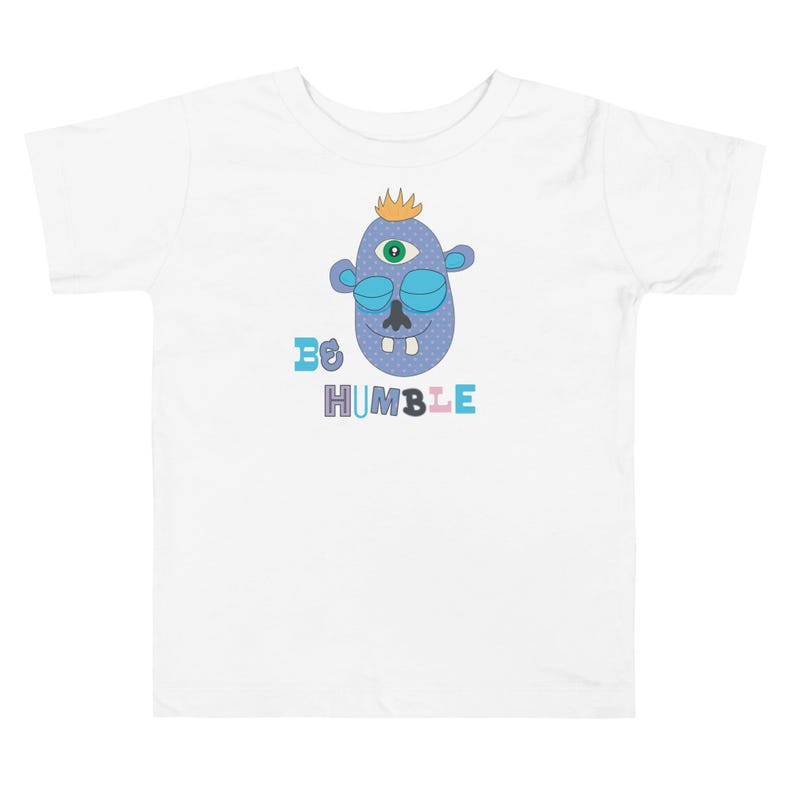 Kids Graphic Tee – BE HUMBLE Magu Shirt | Third-Eye Monster Character | Conscious Kids Clothing for the Whole Family | Toddler & Youth Gift