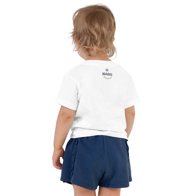 Kids Graphic Tee – SMILE Magu Shirt | Third-Eye Monster Character | Conscious Kids Clothing for the Whole Family | Toddler & Youth Gift