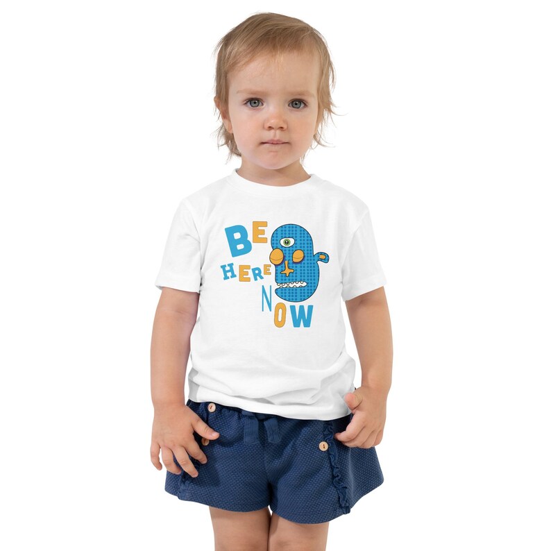 Kids Graphic Tee – BE HERE NOW Magu Shirt | Third-Eye Monster Character | Mindful Conscious Kids Clothing for the Family | Toddler & Youth