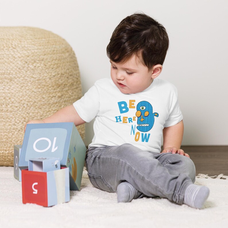 Kids Graphic Tee – BE HERE NOW Magu Shirt | Third-Eye Monster Character | Mindful Conscious Kids Clothing for the Family | Toddler & Youth