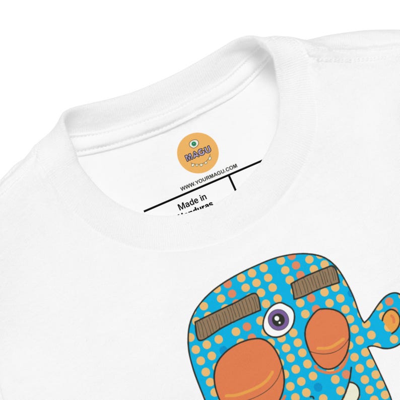 Kids Graphic Tee – SMILE Magu Shirt | Third-Eye Monster Character | Conscious Kids Clothing for the Whole Family | Toddler & Youth Gift