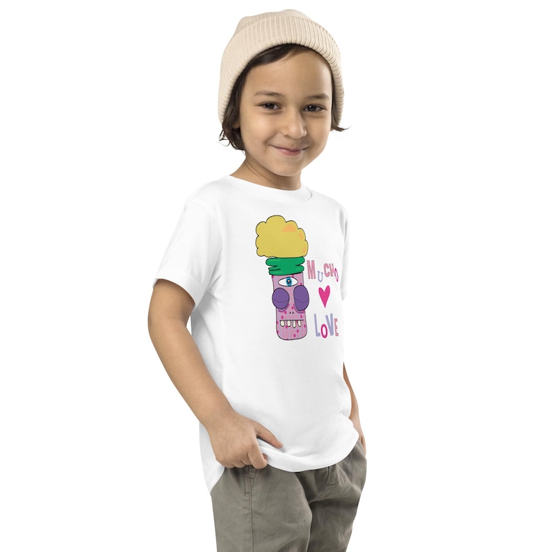 Kids Graphic Tee – MUCHO LOVE Magu Shirt | Third-Eye Monster Character | Conscious Kids Clothing for the Whole Family | Toddler & Youth Gift
