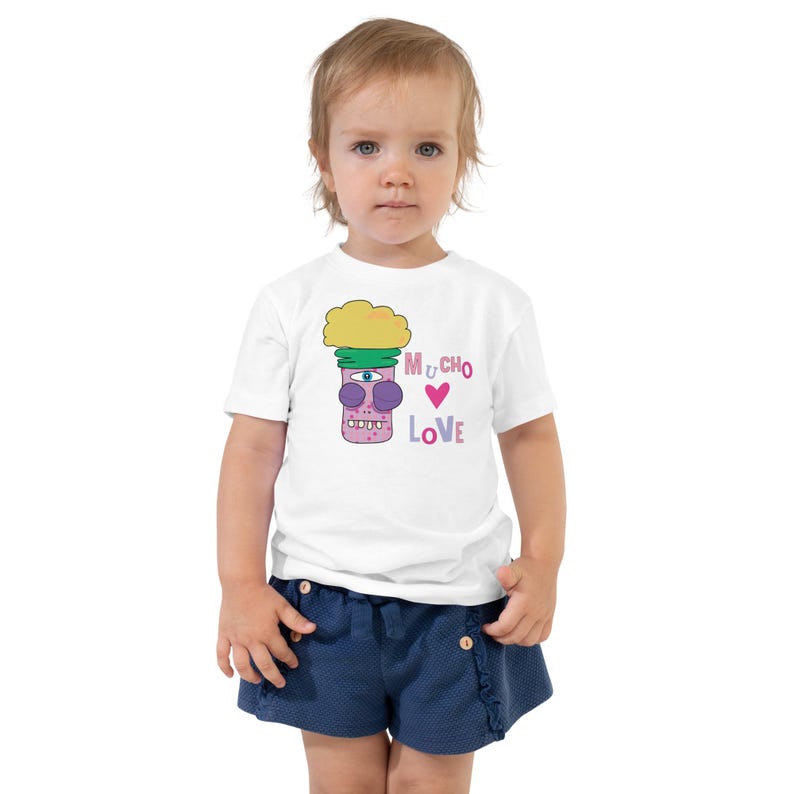 Kids Graphic Tee – MUCHO LOVE Magu Shirt | Third-Eye Monster Character | Conscious Kids Clothing for the Whole Family | Toddler & Youth Gift