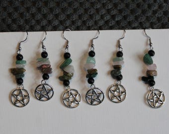May include: Six dangle earrings featuring silver-toned pentacle charms suspended from metal hooks. Each earring includes a vertical arrangement of small, polished black beads interspersed with various multi-coloured natural stone chips.