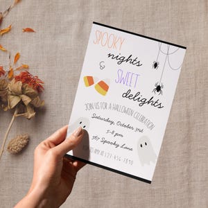 May include: A rectangular Halloween party invitation card featuring the text SPOOKY nights & SWEET delights, candy corn, two ghosts, and two spiders on webs. The card includes event details for Saturday, October 31st, 5-8 pm at 567 Spooky Lane.