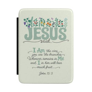 May include: A cream-colored e-reader case featuring a botanical illustration of fruits and vines at the top. The text reads: JESUS said... I Am the vine, you are the branches. Whoever remains in Me and I in him will bear much fruit... John 15:5.