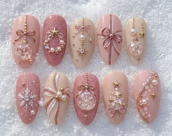 Unghie finte natalizie rosa coquette con fiocco 3D, palla di neve, perle, fiocchi di neve, mandorla, da incollare, set invernale personalizzato
