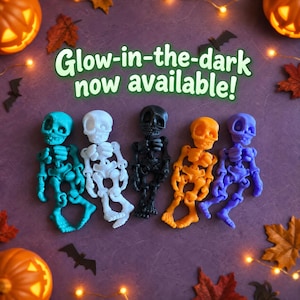 May include: Five articulated skeleton figurines in teal, white, black, orange, and purple. The text Glow-in-the-dark now available! is centered above the figures. The skeletons feature large eye sockets and visible joints for movement.