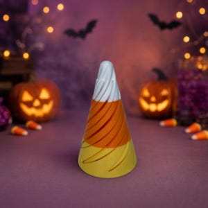 May include: A conical object featuring a spiral design with three distinct horizontal color bands. The top section is white, the middle section is orange, and the bottom section is yellow, mimicking the appearance of a piece of candy corn.