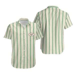 May include: A short-sleeve button-down shirt featuring a cream and green vertical striped pattern. The front displays a small oval patch with the text Cassell's Music. The shirt is shown from both the front and back views, highlighting the collar.