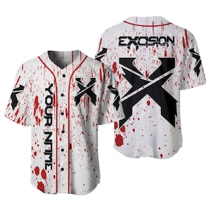 May include: A white baseball jersey with a red splatter pattern, featuring a black X logo on the chest and back. The front includes the text YOUR NAME vertically, while the back displays the text EXCISION above a large black X graphic.