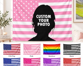 May include: A rectangular wall tapestry featuring a pink and white American flag design with a black silhouette of a person's head in the center. The text "CUSTOM YOUR PHOTO" is printed in white on the silhouette. Below are eight smaller flag variations.
