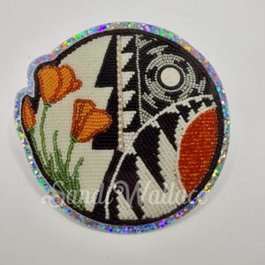May include: A round sticker with a beaded design and orange poppies. The sticker has a silver glitter border and features a black and white geometric pattern. The text "Sandi Wallace" is at the bottom.