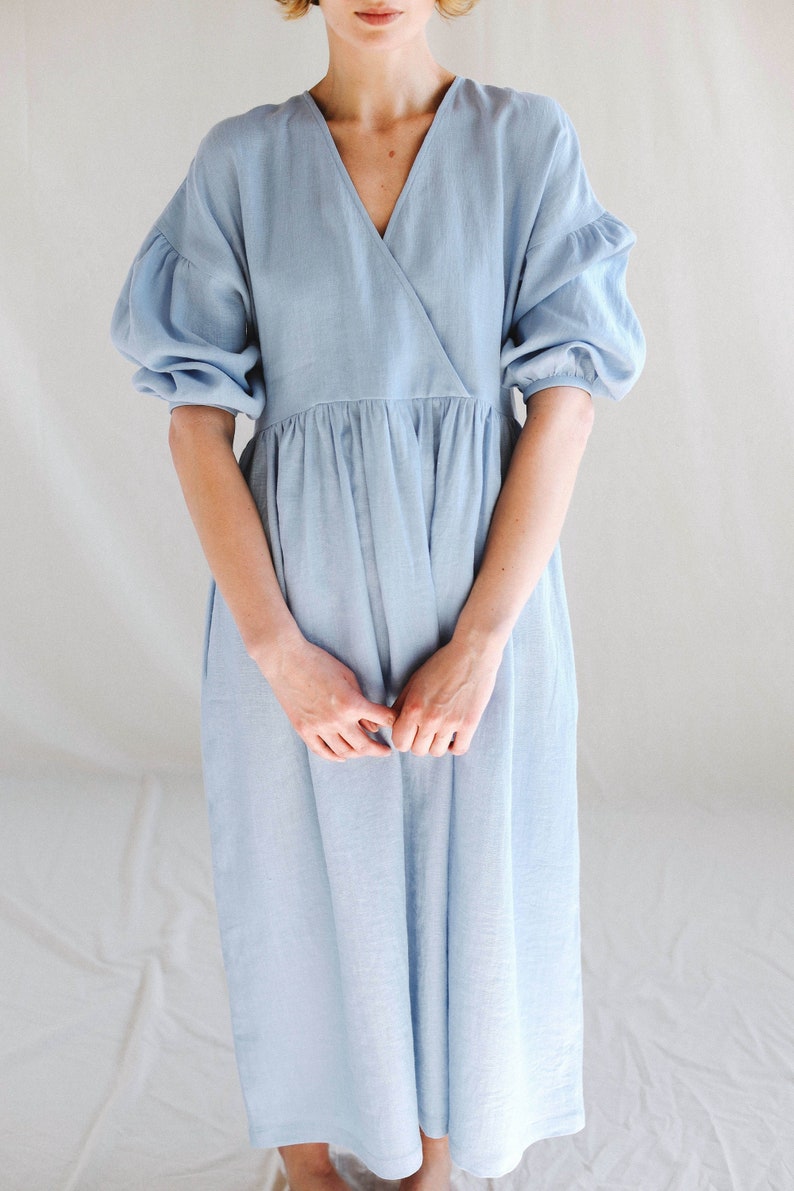 Linen V-neck puffy sleeve dress / OFFON CLOTHING on Etsy - a gorgeous chambray color perfect for a breezy coastal and timeless look. #chambray #dresses #handmadeclothing