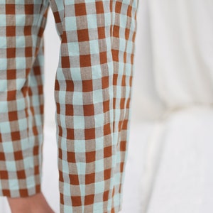 May include: Brown and light blue checkered pants.