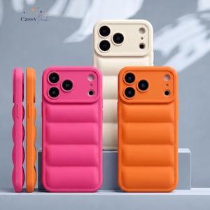 May include: Three puffer-style phone cases in bright pink, vibrant orange, and cream. Each case features a quilted, padded texture, a raised camera cutout with circular lens openings, and side button covers. The text Cassy Pouch is visible.