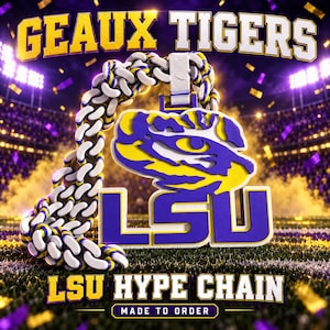 May include: A thick, chunky chain necklace featuring a large pendant with a purple and yellow tiger head logo above the letters LSU. The chain links are coloured in a repeating purple, white, and yellow pattern. Text reads GEAUX TIGERS and LSU HYPE CHAIN.