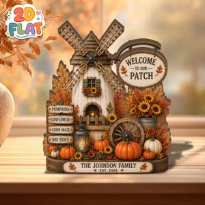 May include: A decorative wooden windmill display featuring a sign that reads Welcome to Our Patch. It includes a signpost with PUMPKINS, SUNFLOWERS, CORN MAZE, and HAY RIDES, plus orange pumpkins, sunflowers, and a base labelled THE JOHNSON FAMILY EST. 2026.