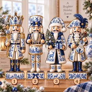 May include: Four decorative nutcracker figurines featuring a white and blue floral pattern. The first wears a crown and holds a scepter, the second plays a drum, the third holds a small tree and gift, and the fourth plays a violin.