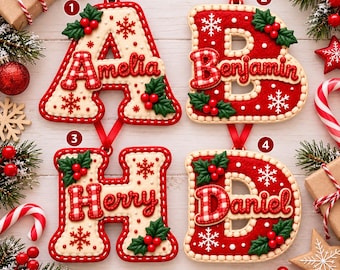May include: Four letter-shaped Christmas ornaments labeled 1, 2, 3, and 4. Each ornament features a red and white color scheme with holly berry accents, snowflake patterns, and a red ribbon for hanging. The letters A, B, H, and D are personalized with the names Amelia, Benjamin, Herry, and Daniel in red gingham font.