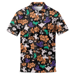 May include: A short-sleeve polo shirt with a black background featuring an all-over print of orange hibiscus flowers, white ghosts, purple witch hats, green monster hands, skulls, and eyeballs. The shirt has a collar and a button placket.