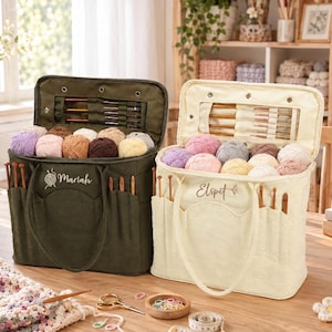 May include: Two rectangular fabric yarn storage bags, one olive green and one cream, each featuring an open top, exterior pockets holding crochet hooks, and an interior flap with clear slots for needles. The bags are embroidered with the names Mariah and Elspet.