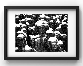 Black and white photo of Raymond Mason's sculpture La Foule under the snow, Jardin des Tuileries, Paris. Interior wall decoration